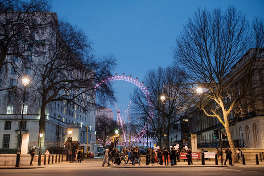 The London eye at night view from a city running tour of London 